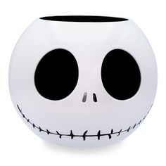 a white ball shaped like a jack skellingy face with black eyes and mouth