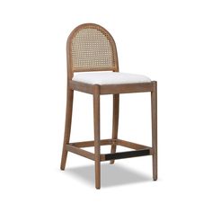 a wooden bar stool with white upholstered seat and backrest, on a white background