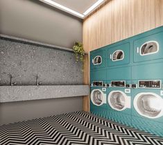 a washer and dryer in a bathroom with black and white chevron flooring