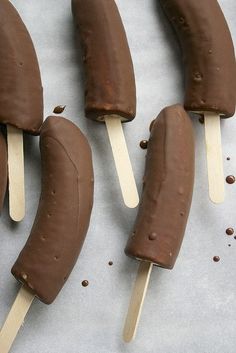 four popsicles with chocolate on them and the words, straighten it up