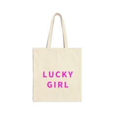 Lucky Girl Pink Cotton Canvas Tote Bag. This 100% cotton bag comes in one size - 15" x 16"- perfect for everyday wear. .: 100% cotton canvas .: Heavy fabric Trendy Canvas Beach Bag, Cute Cotton Shoulder Bag With Letter Print, Cute Canvas Shoulder Bag For Everyday, Cute Everyday Canvas Shoulder Bag, Trendy Canvas Bag, Cute Rectangular Cotton Shoulder Bag, Trendy Canvas Tote Bag With Letter Print, Pink Cotton Bags With Letter Print, Casual Pink Cotton Canvas Bag