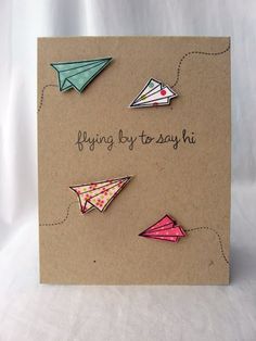 a card with some origami on it and the words flying by to say hi