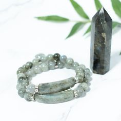 This beaded bracelet is made of natural Labradorite gemstone and has a beautiful heart charm. Labradorite has a pearly sheen and some specimens have a shimmer effect. Our Gemstone Beaded Bracelets are designed to feel lightweight, comfortable, and effortless.Stringing each natural stone is part of our mindful Intention when we create this beaded bracelet, infusing positive energies, love, and happiness within each design.We combine meaningful symbols and natural gemstones giving this one accesso Moonstone Bracelets With Natural Stones For Healing, Healing Moonstone Bracelet With Natural Stones, Bohemian Labradorite Healing Bracelet, Adjustable Labradorite Spiritual Beaded Bracelets, Healing Labradorite Beaded Bracelets With Natural Stones, Adjustable Labradorite Beaded Bracelets For Spiritual Healing, Adjustable Labradorite Beaded Bracelets For Spiritual Wear, Adjustable Labradorite Spiritual Crystal Bracelet, Healing Labradorite Beaded Bracelets With 8mm Beads