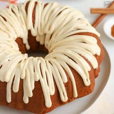 a bundt cake with white icing on a plate