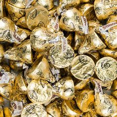 a pile of gold foiled chocolate hearts