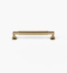 a brass cabinet handle on a white background