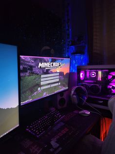 two computer monitors sitting next to each other in front of a keyboard and mouse on a desk