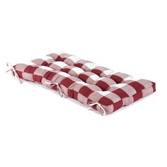 a red and white checkered cushion with ties