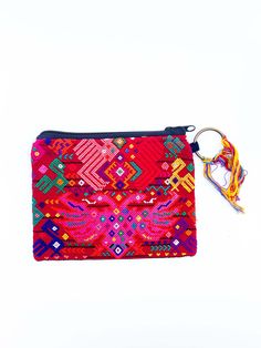 This huipil pouch is made beautifully by artisans in Guatemala. This one of a kind cosmetic bag its handwoven through curated vintage fabrics made from a "huipil", Mayan traditional blouse. Each town or region from Guatemala, has their own specific pattern and style, often using different weaving techniques. This makes Mayan weaving tradition rich in cultural history. Each bag is uniquely charming, no two are the same! Textile patterns and colors plus weaving techniques differ and represent a sp Bohemian Woven Pouch For Gift, Multicolor Embroidered Pouch For Festivals, Bohemian Woven Pouch Clutch, Bohemian Woven Rectangular Pouch, Bohemian Zipper Pouch, Traditional Pouch Coin Purse For Everyday Use, Traditional Handwoven Clutch Bag, Traditional Everyday Coin Purse Pouch, Handwoven Pouch For Daily Use