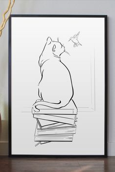 a black and white drawing of a cat sitting on top of a stack of books