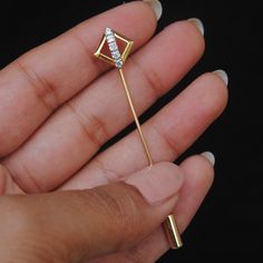 "Crafted in solid 14K Gold, this simple yet stylish lapel pin studded with natural diamonds makes for a perfect gift for the amazing males in your life, for whom finding a gift is almost impossible! * Diamond Wt : 0.14Ct * Color/Clarity Grade - H-I, Vs-Si Purity * Gold - 1.8g, 14K Solid Yellow Gold * Dimension of the design : 12mm x 12mm * Total Length - 2.3\" (approx) * Pin - 18 gauge (1.2 mm) Gold Lapel Pin - Stick Pin for Men - Coat Hat Tie Pin - Gifts for Father Brother Husband If you like t Classic Formal Jewelry With Diamond Markers, Luxury Gold Lapel Pin For Anniversary, Luxury Gold Lapel Pin For Wedding, Classic Gold Lapel Pin For Anniversary, Luxury Yellow Gold Lapel Pin For Formal Events, Classic Gold Lapel Pin For Wedding, Elegant Yellow Gold Wedding Lapel Pin, Classic Gold Pins For Formal Occasions, Formal Gold Jewelry With Diamond Markers