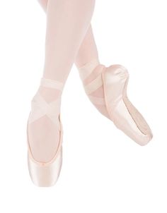 the feet of a ballerina in pink ballet shoes