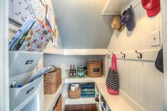 the inside of a closet with baskets and other items