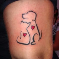 a dog tattoo with hearts on its leg