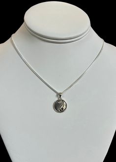 The beauty of the Yin Yang in a curb style chain.  Beautiful necklace to wear and keep close to your heart for inner peace.  This silver necklace is stylish and trendy. It is a very charming gift for yourself or someone special.   This is a must have in your jewelry collection. Description: > Chain :  Curb 1.7mm - .925 Sterling Silver  > Sizes offered : 16in, 18in, 20in > Charm - Sterling Silver  > Charm height - 16mm We include a anti-tarnish strip and bag for the care of your necklace. Shippin Yin Yang Necklace, Beautiful Necklace, Necklace Sterling Silver, Charm Gift, Sterling Silver Charm, Yin Yang, Inner Peace, Beautiful Necklaces, Silver 925