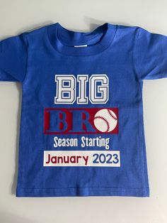 "Item details below: Big Bro Shirt - Big Brother Announcement Shirt - Pregnancy Announcement Shirt - Big Bro Shirt - Big Brother Baseball Shirt - New Baby Announcement Big Bro This is the sweetest shirt for a new big brother if you are looking to share the news in a BASEBALL theme! (Please note- other sports can be switched out!) Just let me know the date you want this customized with! I have three color options set up on this listing. All will come with white and red graphics. But please contac Customizable Blue Tops For Baseball Season, Family Matching Blue Pre-shrunk Shirt, Customizable Short Sleeve Tops For Gender Reveal, Blue Short Sleeve Shirt For Baseball Season, Blue Pre-shrunk Family Matching Shirt, Family Matching Blue Shirt With Name Print, Brother Announcement, Big Bro Shirt, Big Brother Announcement Shirt