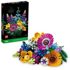 a bunch of flowers that are next to a box