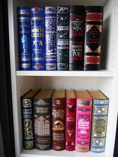 a shelf filled with lots of different types of books on top of eachother