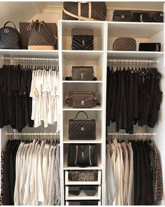 an organized closet with white shelving and black handbags on the shelves, including purses