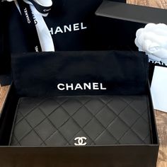 This Yen Wallet From Chanel Is A Wonderful Creation! This Black Wallet Is Crafted From Lambskin Leather And Features The Signature Quilted Pattern All Over The Exterior Along With The Cc Logo To The Front. The Bi-Fold Piece Opens To A Leather And Fabric Interior That Houses Multiple Card Slots And Open / Zipper Compartments. Pre-Owned, In Very Good Condition. Please See All Photos For Further Details And Ask Questions If You Have Any Before Purchasing. Thank You Width (Inch) : 7.08 Inch(Approx) Width (Cm) : 18 Cm(Approx) Height (Inch) : 3.93 Inch(Approx) Height (Cm) : 10 Cm(Approx) Depth (Inch) : 0.78 Inch(Approx) Depth (Cm) : 2 Cm(Approx) Color: Black Material: Lambskin Leather Comes Black Luxury Rectangular Wallet, Luxury Black Wallet For Gift, Black Bifold Evening Bag, Designer Black Clutch Wallet, High-end Black Wallet For Everyday Use, Luxury Evening Wallets With Interior Card Slots, Luxury Evening Wallet With Interior Card Slots, High-end Leather Wallet For Formal Use, High-end Black Wallet For Formal Occasions