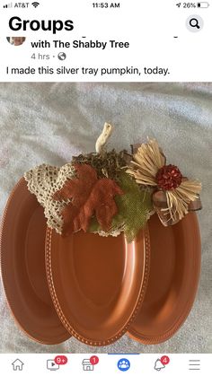 three orange plates sitting on top of a table