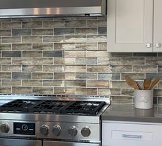 a stove top oven sitting inside of a kitchen next to a microwave and countertop