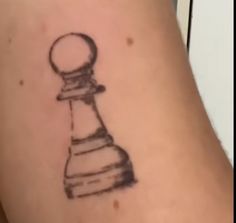 a tattoo with a chess piece drawn on it