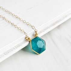 A simple yet charming staple, featuring a hexagon gemstone pendant. It's an everyday favorite that always feels special. GEMSTONE: Apatite SIZE: ~ 0.6" long CHAIN: 18" long 14k gold filled / sterling silver CLOSURE: Lobster clasp Dainty Gemstone Necklace, Layering Necklace, Gems Jewelry, Long Chain, Gold And Silver, Gemstone Necklace, Gemstone Pendant, Crystal Jewelry, Layered Necklaces