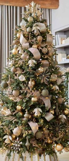 a christmas tree with gold and silver ornaments