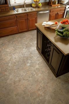 a kitchen with brown cabinets and counter tops