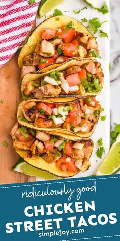 chicken street tacos on a white plate with limes and cilantro in the background