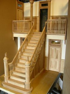 the stairs are made out of wood and have balconies