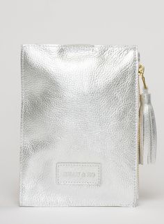 This bag is made from high-quality, super-soft metallic silver leather sourced from a premiere hide house in California. The leather is shipped to New York City, where our bags are produced by expert craftsmen and finished with a smooth zipper, leather tassel, and bamboo ring. Just big enough for all your essentials, we designed the Ring Wristlet to be your go-to bag for going out! Whether you’re heading to a cocktail party, a concert, or out on the town, slip it on your wrist so your hands are Silver Pouch Clutch For Travel, Silver Pouch For Everyday Use, Silver Leather Bags With Zipper Closure, Silver Pouch With Removable Pouch For Everyday Use, Silver Leather Bag With Zipper Closure, Silver Clutch With Removable Pouch For Daily Use, Silver Rectangular Soft Leather Bag, Modern Silver Textured Leather Bag, Silver Leather Pouch Bag