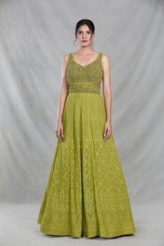 Green sleeveless full length gown with Mughal bloom embroidery using thread, sequin, beads and cutdana highlights. Paired with a ditsy sequin floret work dupatta. - Aza Fashions Festive Sleeveless Anarkali Embroidered Dress, Sleeveless Embroidered Dress With Resham For Wedding, Festive Sleeveless Dress With Fitted Bodice, Green Floor-length Dress With Chikankari Embroidery, Festive Sleeveless Anarkali Maxi Dress, Sleeveless Resham Embroidered Fitted Dress, Sleeveless Gown With Intricate Embroidery For Wedding, Sleeveless Gown With Intricate Embroidery, Festive Sleeveless Dress With Zari Work