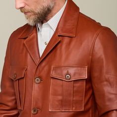 This rugged Safari Leather jacket is a vintage look that is sure to keep you warm while you brave the cold. Adorned with two upper pockets and two lower pockets, this piece enables you to pack as heavy or light in the cold as you like. Layer this Safari Jacket with a lightweight sweater or simple button down to achieve a dynamic look of western sophistication. Model is 6'1 and wearing size M. Winter Leather Utility Jacket With Flap Pockets, Business Leather Jacket With Pockets, Rugged Leather Jacket With Pockets For Winter, Winter Utility Leather Jacket With Multiple Pockets, Brown Winter Utility Jacket With Pockets, Brown Utility Outerwear With Patch Pockets, Utility Leather Outerwear With Pockets, Classic Winter Leather Jacket With Pockets, Winter Business Utility Jacket With Pockets