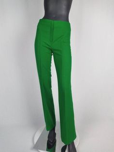 Fabulous 70s vintage flared pants/ bell-bottoms by Gaston Jaunet. Made from bright grass green wool. Featuring front zip closure, top stitch details. Unlined. Made in France. SIZE TAG: F40, in modern sizing more like F38. Please check measurements below. FABRIC CONTENT: 85% wool 15% polyamide CONDITION: excellent. MEASUREMENTS (taken flat, not doubled): Waist: 36 cm / 14 1/4" Hip: 48 cm / 19" Front rise: 26 cm / 10 1/4" Inseam: 82 cm / 32 1/2" Flare: 27 cm / 10 3/4" Please do not hesitate to contact me if you have any questions. Retro Fitted Flares For Spring, Fitted Retro Flares For Spring, Fitted High-waisted Green Pants, Green Fitted High-waisted Pants, Fitted Green Wide Leg Bottoms, Green Fitted Wide Leg Bottoms, Fitted Wide Leg Green Bottoms, Fitted Green Pants, Spring Vintage Fitted Flares