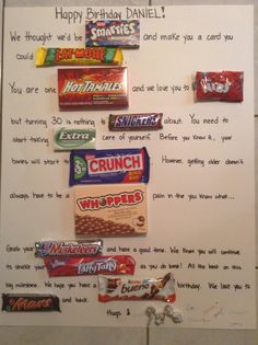 a birthday card with candy and candies attached to the side of a refrigerator freezer