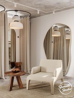 a white chair sitting in front of a mirror next to a wooden table and lamp