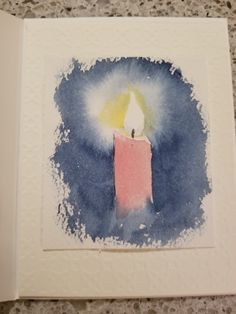 a lit candle is in the middle of a painting