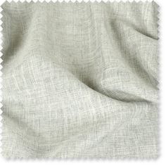 a close up view of the fabric that has been made into a bed spread with white linen