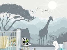 a baby's room with a giraffe mural and crib in the foreground