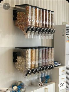 a wall mounted spice rack filled with lots of spices