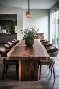 a large wooden table with chairs around it