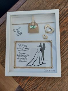 a white frame with some magnets on it and a couple's wedding date