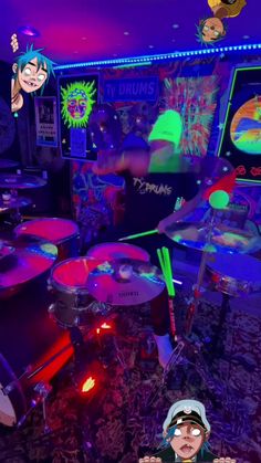 a man sitting in front of a drum set