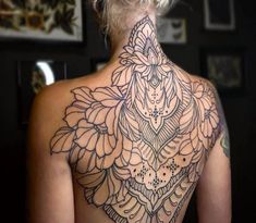 a woman with a tattoo on her back