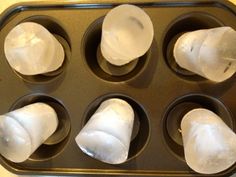 an uncooked muffin tin filled with icing