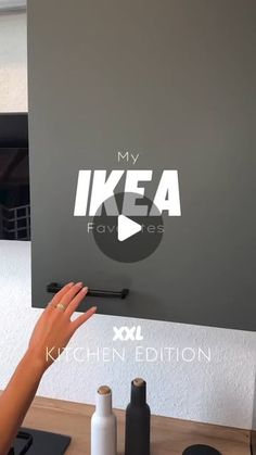 someone is holding their hand up in front of a tv screen that says, my ikea faves