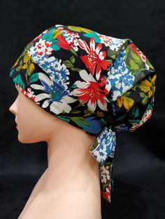 a mannequin head wearing a flowered hat