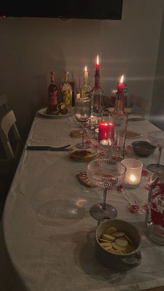 a table with candles and dishes on it